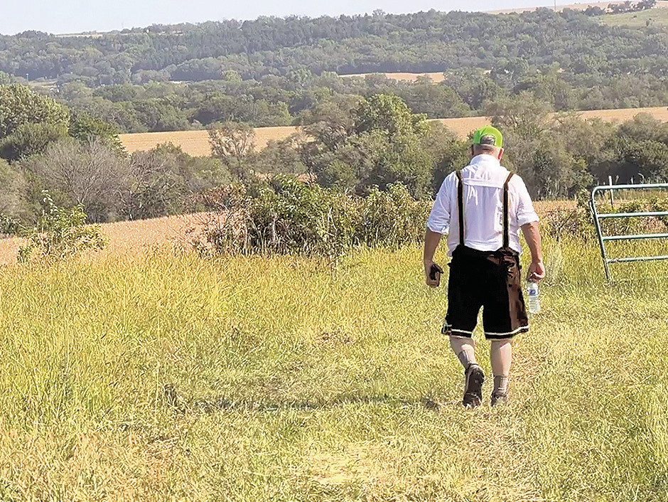 The Uplands of Sheridan Township were the star of the 2026 Volksmarch held by the Rock Country School Foundation last weekend. They form the rim of the Nemaha River Valley. Here, Howard Blecha hikes the last long downhill slope.