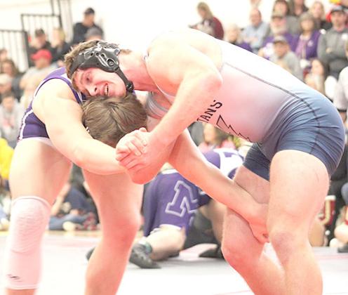 HTRS/P.C.’s Andy Maloley (right) battles against a Milford wrestler in the semifinals at Fairbury last Friday. photo courtesy of Jamie Maloley