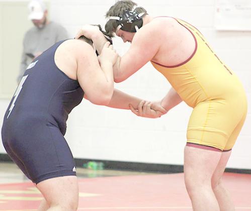 HTRS/P.C.’s Ty Faulks (left) locks up with a Fairbury wrestler at the Fairbury Invitational on Friday. photo courtesy of Jamie Maloley