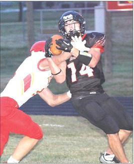 P.C.’s Jett Farwell (#14, right) fights for a touchdown early in the game against Red Cloud. Farwell had 2 catches for 30 yards and 2 TD’s. Paula Jasa/Republican