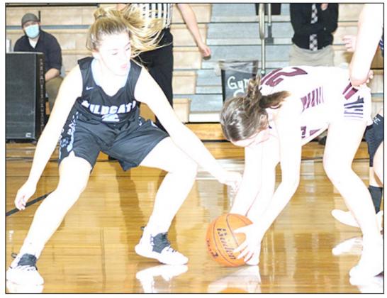 LHS’ Carleigh Weyers (#24, right) picks up a quick steal in Friday night’s game against Cedar Bluffs. Weyers scored 15 points and had 9 steals in the game. Paula Jasa/Republican