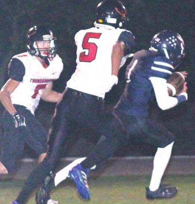 HTRS’ JJ McQueen (#1, center) splits JCC defenders for a late touchdown in the first half. Paula Jasa/Republican