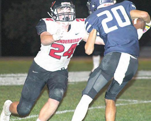 HTRS’ Nic Knudson (#20, right) makes a move down the sidelines to get extra yardage against JCC. Knudson had 7 catches for 63 yards against the Thunderbirds. Paula Jasa/Republican