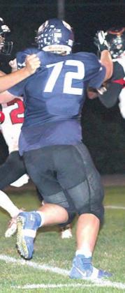 HTRS’ Ryken Davis (#72) puts pressure on the JCC quarterback in the first half of the Homecoming game on Friday night. Davis had 11 tackles in the game. Paula Jasa/Republican