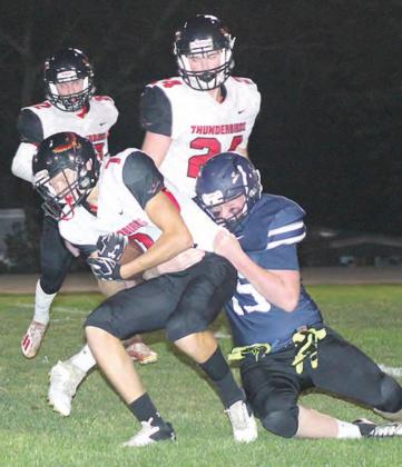 HTRS’ Colt McClarnen (#45, right) brings down a JCC ball-carrier in the first half of Homecoming night play. Paula Jasa/Republican