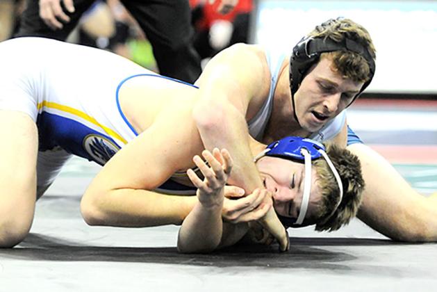 HTRS/P.C.’s Andy Maloley (right, on top) keeps Tri-County’s Cael Washburn pinned to the mat in Friday’s wrestle back match. photo provided by Luke Nichols/Beatrice Daily Sun