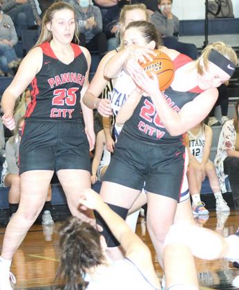P.C’s Reagan deKoning (#20) fights for a rebound inside as several Titan players battle her. Paula Jasa/Republican
