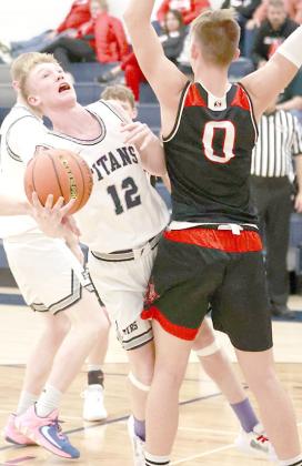 HTRS’ Brogan Dunlap (#12, center) drives the paint against Wymore Southern in the Titans’ home game on Saturday, December 17th. The Titans lost to the Raiders by a 39-71 score. (Individual statistics were not available at the time of printing.) photo courtesy of Lorrie Novak