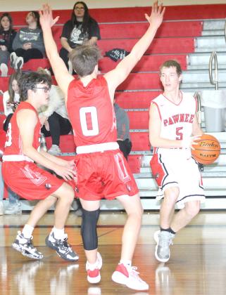 P.C.’s Justin Pierce (#5, right) drives the baseline against W.W. looking for an open teammate on Tuesday night, December 20th. Pierce led the team with 5 assists. Paula Jasa/Republican