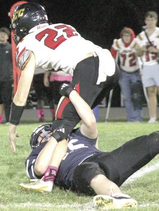 HTRS’ Griffin Sikora (#55, on ground) sacks the JCC quarterback late in the game on Thursday. Paula Jasa/Republican