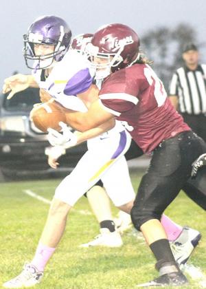 LHS’ Cayd Wilgers (#26) gets a quarterback sack early in the first quarter. Paula Jasa/Republican