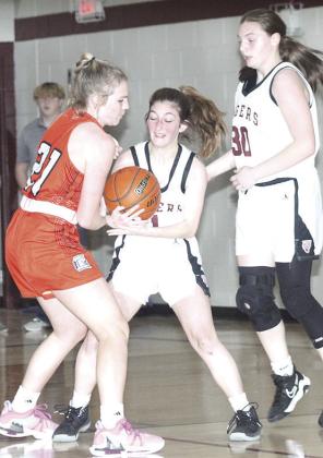 LHS’ Kierstin Rehrs (center) fights with a Diller/Odell player for possession as teammate Sara Wiles (#30, right) looks to help out. Paula Jasa/Republican