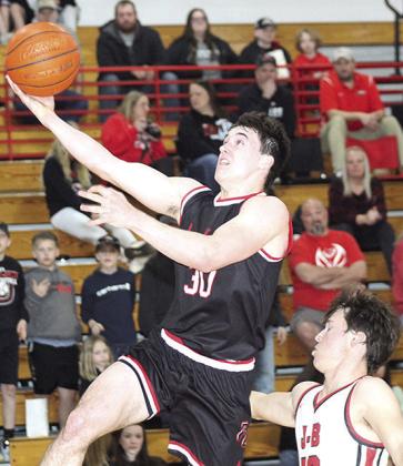 P.C.’s Jett Farwell (#30, left) flies past an Eagle defender on his way in for an easy bucket. Paula Jasa/Republican