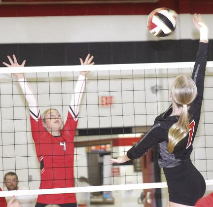 P.C.’s. Adrian deKoning (#7, right) powers a spike past a Wymore Southern blocker in last Tuesday’s match. P.C. won in straight sets, 25-15, 25-18. Paula Jasa/Republican