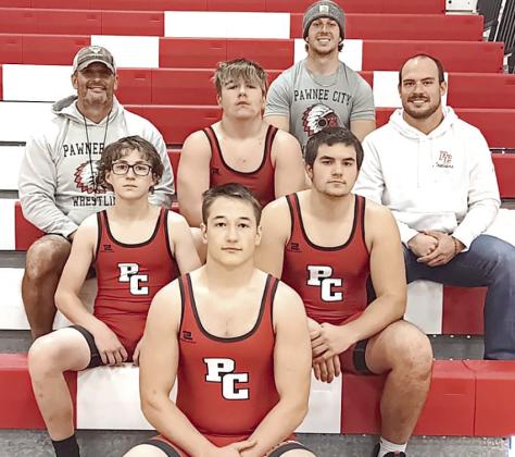 Members of the 2024-25 Pawnee City Wrestling Team are front: Jesse McLaughlin. Second row: Luke Hunzeker and Dylan Layne. Third row: Head Coach Shane Maloley, Gauge Schuetz, Coach Josh Andreasen. Back row: Coach Andy Maloley.