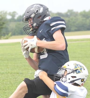 HTRS’ Brogan Dunlap (#3, left) catches a 12 yard touchdown pass to open the game. Dunlap had 2 catches for 35 yards and 2 TD’s. Paula Jasa/Republican