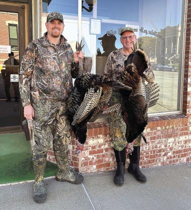 Second Place Adult Division contestant Patrick Snickles (right) with son Brandon Snickles (left) pose in front of the Pawnee Republican with their harvests