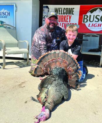 Mason Ellston and dad pose with the Fourth Place bird in the Youth Division
