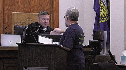 Ralph Schiffbauer (right) receives his certificate of completion from Judge Richard Smith (left)