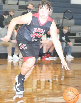 P.C’s Joseph Marteney drives the ball down the floor against HTRS. Marteney led the Indians with 13 points. Paula Jasa/Republican
