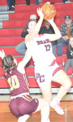Pawnee City’s Neveah Blecha (#12, right) goes in for a left-handed layup attempt against a Sterling defender. Paula Jasa/Republican