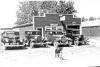 Cars in front of Buchholz Garage in TR, 1949, with dog Rick