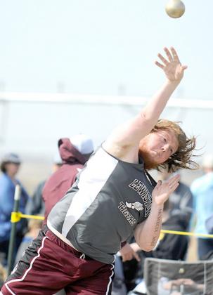 Lewiston’s Shawn Salts heaves a throw in the boys’ Shot Put event. photo courtesy of Luke Nichols/Beatrice Daily Sun
