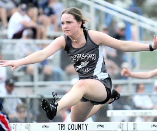 Lewiston’s Carleigh Weyers clears a final hurdle in the 100 M. hurdle event. photo courtesy of Luke Nichols/Beatrice Daily Sun
