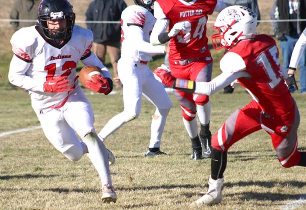 P.C.’s Andy Maloley (#12, left) takes off on a run against Potter-Dix in Friday’s quarterfinal game. Maloley had 19 carries for 163 yards and 3 TD’s in the game. photo courtesy of Jamie Maloley