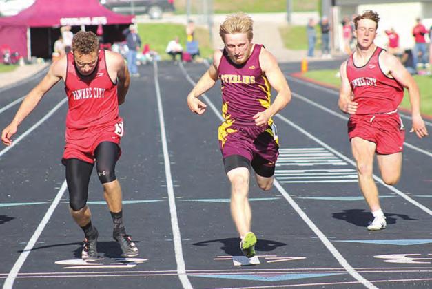 Pawnee City’s Jacob Lytle (left) finishes a close 2nd to Sterling’s Derek Buss (center) while P.C. teammate Andy Maloley (right) takes 3rd in the 200 M. Dash. Lytle qualified for four events for the 2021 State Track Meet at the Class D-1 Districts. Paula Jasa/Republican