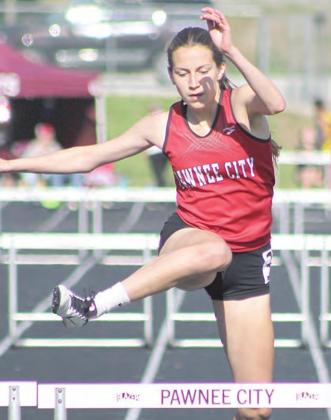 P.C.’s Madison Lytle clears her final hurdle in the 300 M. Hurdle event to take 5th place at 54.33. Paula Jasa/Republican