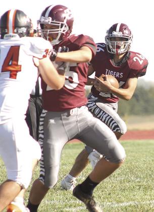 LHS’ Alexander Seeman (#26, right) looks to get past the D/O defense with the help of teammate Brock Janssen (#25, center) in Lewiston’s Homecoming game. Paula Jasa/Republican