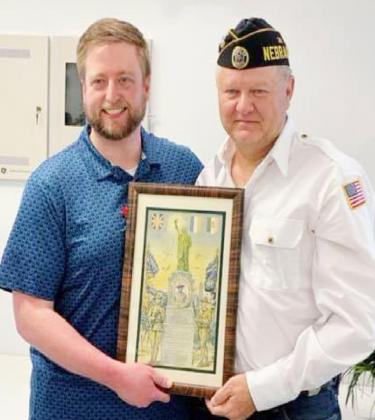 Photo upper right...Mark Magnuson presenting the plaque to Commander Rand Schafer.