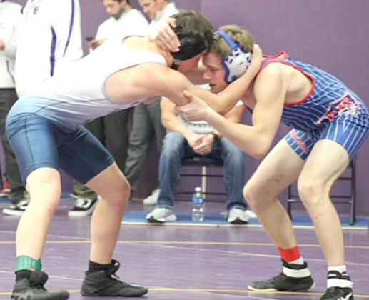 HTRS/P.C.’s Aiden Worthey (left) goes toe to toe with an opponent at the Louisville Invite. Worthey won the 195 lb. division. photo courtesy of Shane Maloley