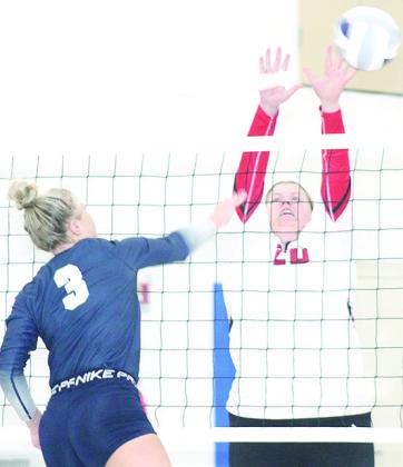 HTRS’ Macy Vrtiska (#3, left) powers a spike past a Wymore Southern defender last Thursday. Paula Jasa/Republican