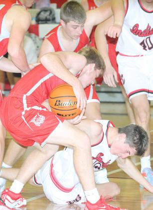 P.C.’s Drew Menninga (on floor) battles Frankfort for possession late in the game on Friday night. Paula Jasa/Republican