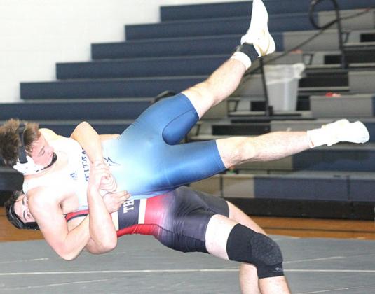 HTRS/P.C’s Isaac Bittner (in grasp) gets taken down viciously in a match against Johnson County Central on Thursday. Paula Jasa/Republican