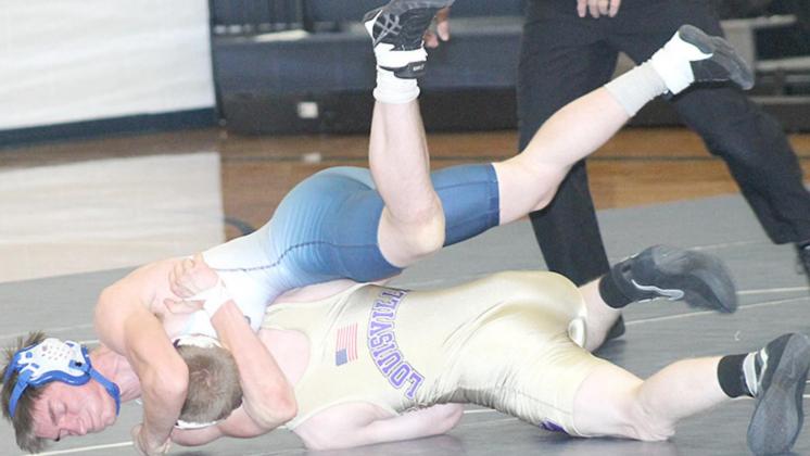 HTRS/P.C’s Caleb Werman (on top) takes down a Louisville opponent. Paula Jasa/Republican