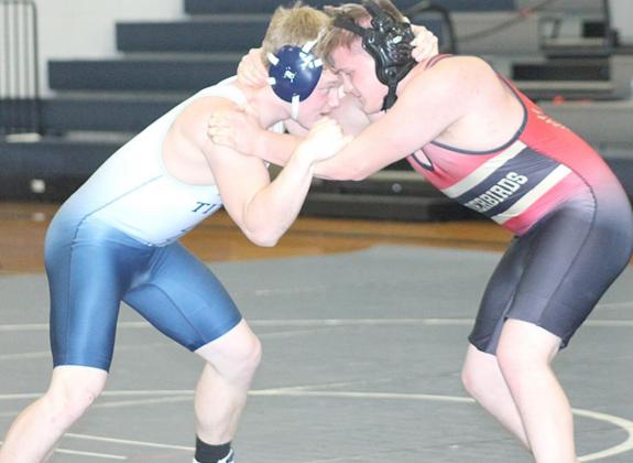 HTRS/P.C’s Clayton Shook (left) goes up against a JCC opponent in his last match of the night and wins by a pin in the 2nd period with 58.2 seconds left. Paula Jasa/Republican
