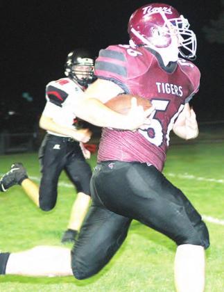 LHS’ Ty Arena (#56) rumbles over the right side for a 20 yard touchdown right before halftime. Paula Jasa/Republican