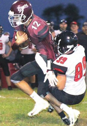 LHS’ Abel Gonzalez (#12, left) takes off on a run early in the game before leaving with an injury. Paula Jasa/Republican