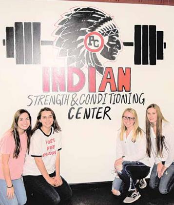 From left: Reyana Tegtmeier, Tristen Bradbury, Reagan de Koning, Madison Branek. These students drew this mural among others at the Pawnee City Schools Fitness Center. Ray Kappel/Republican