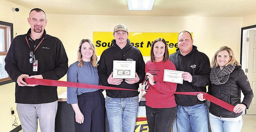 The Pawnee City Chamber of Commerce joined Southeast NE Feeds for their grand opening yesterday. As part of ceremonies, the Chamber sponsored a ribbon cutting and awarded Southeast NE Feeds first-year membership in the Chamber and a certificate of new business. Pictured L to R: Brian Rottinghaus (Chamber rep), Shelby Barnes, Kaden Barnes, Joni Hegemann, Jesse Hegemann, Amanda Niss (Chamber rep)