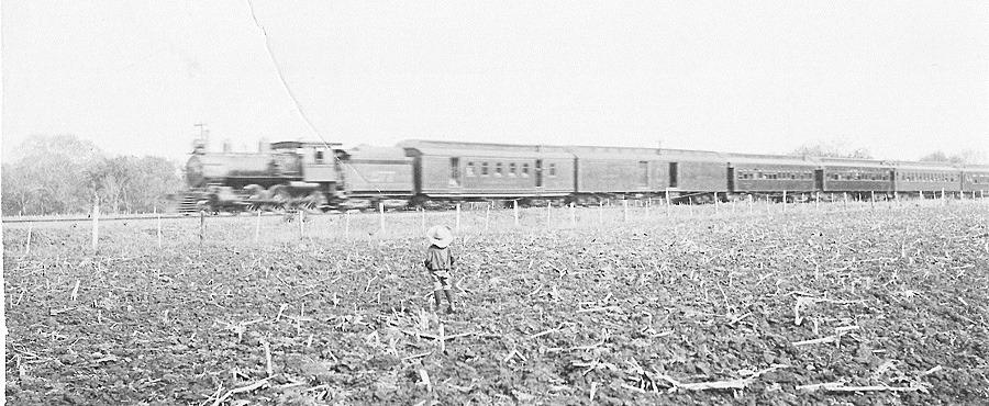Above: Emory Purcell, a member of the Table Rock family of Jack and Ida Purcell, watches a train go by, probably one of the cannonballs between Kansas City and Denver. This is a Purcell family photo shared by Terry Korell of Lingle, Wyo-ming.