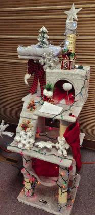 S.H.R.E. Animal Resue won sendond place in the Christmas Tree Lae contest with their decorates Cat Tree.