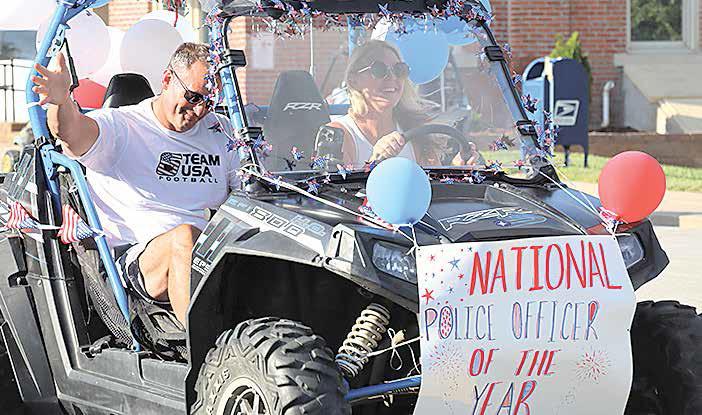 Sgt. Shane Maloley, the Steinauer Parade Grand Marshal, was named the National Law Enforcement of the Year by the American Legion. Evelyn Fink riding her tricycle in the parade.