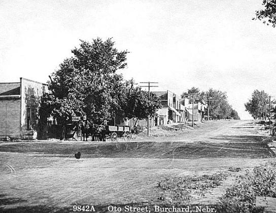 Below: Vintage postcard showing downtown Burchard circa 1909, soon after Frank Doering sold his meat market and ice house to Gotlieb Steinauer. The telephone had arrived in Burchard. The Burchard Times newspaper had Phone No. 12.