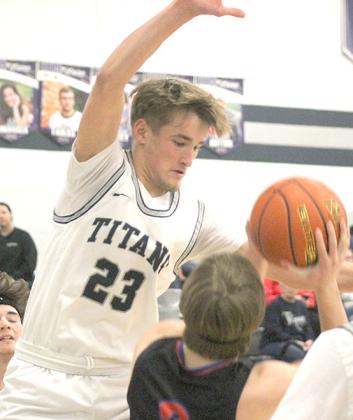 HTRS’ Brandt Leech (#23, left) goes up for a block against Palmyra in the first half of the game. Paula Jasa/Republican
