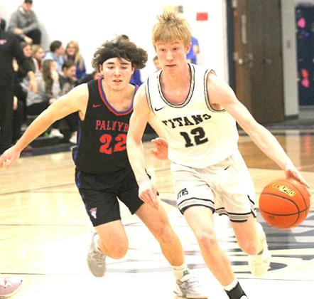HTRS’ Brogan Dunlap (#12, right) races past a Palmyra defender in Friday night’s last home game. Paula Jasa/Republican