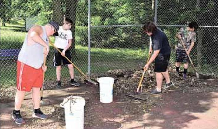 The boys working at South Park last week were, from left, Keegan Vetrovsky, Brysen Horst, Anthony Moore, and Graham Moore. Ray Kappel/Republican